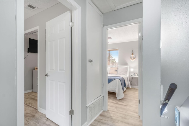 hallway with light hardwood / wood-style flooring