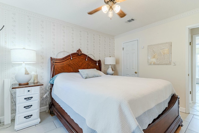 bedroom with light tile patterned flooring, visible vents, baseboards, and wallpapered walls