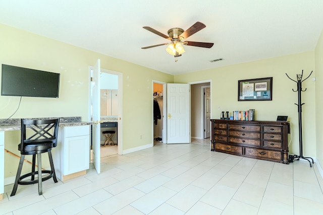 bedroom featuring baseboards, visible vents, and ceiling fan