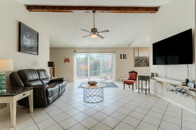 living area with light tile patterned floors, baseboards, a ceiling fan, lofted ceiling with beams, and a textured ceiling