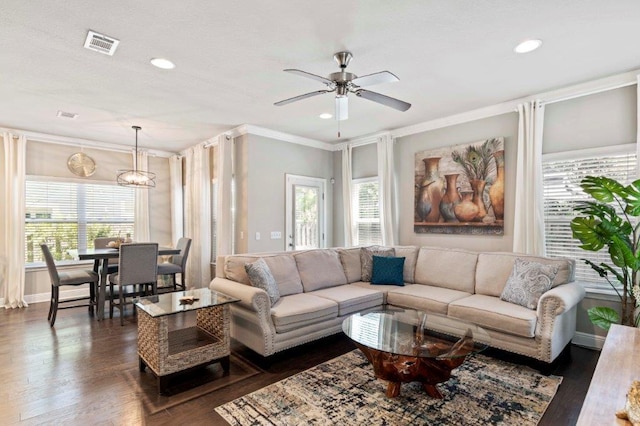 living room featuring ornamental molding, dark hardwood / wood-style floors, and ceiling fan