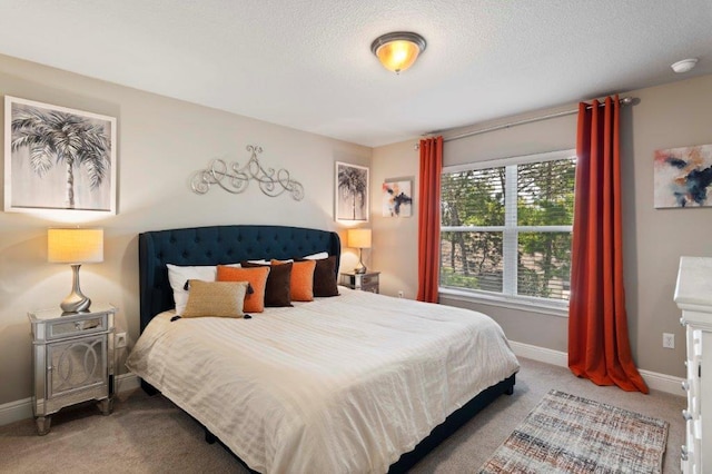 carpeted bedroom featuring a textured ceiling