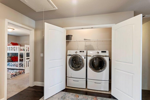 clothes washing area featuring independent washer and dryer and carpet