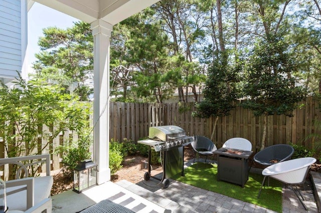 view of patio featuring a grill