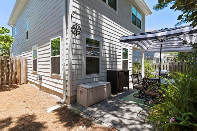 view of side of home featuring a patio area