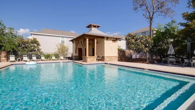 view of swimming pool featuring a patio