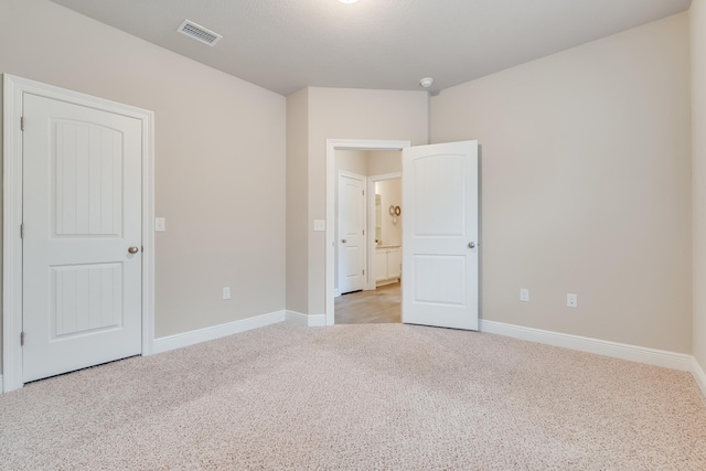 unfurnished bedroom with light carpet