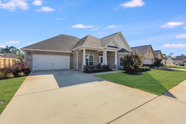 craftsman-style house with a garage and a front yard