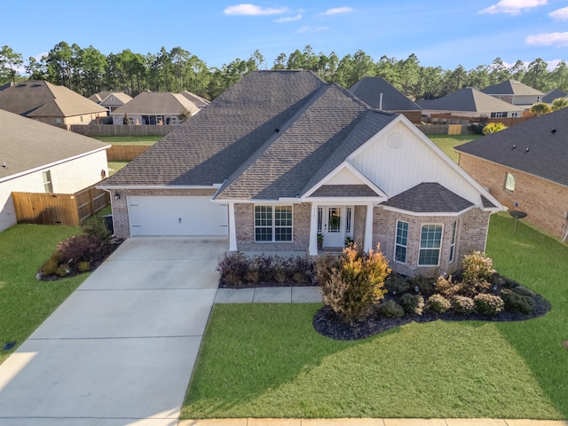 view of front of property with a garage and a front yard