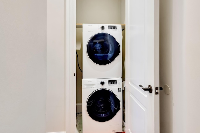 laundry area with stacked washer and clothes dryer