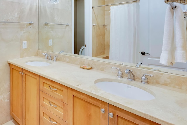 bathroom with vanity, curtained shower, and tile walls