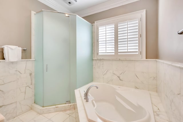 bathroom featuring crown molding, independent shower and bath, and tile walls