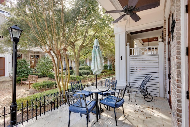 view of patio featuring ceiling fan