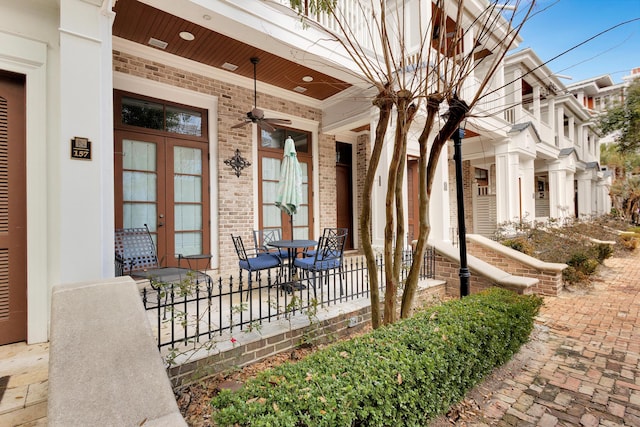 doorway to property with ceiling fan and french doors