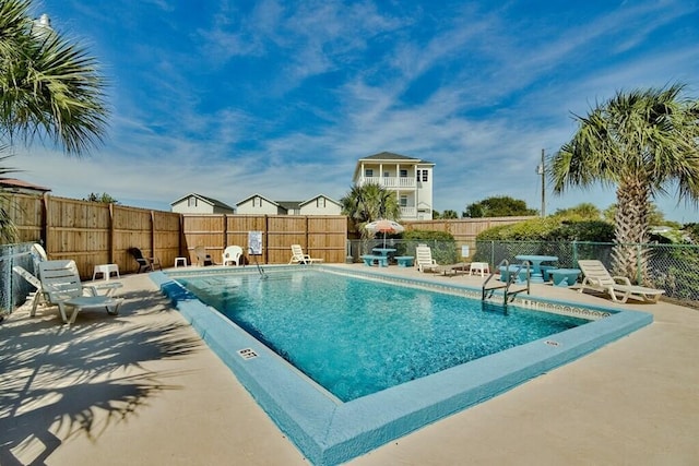 view of swimming pool featuring a patio area