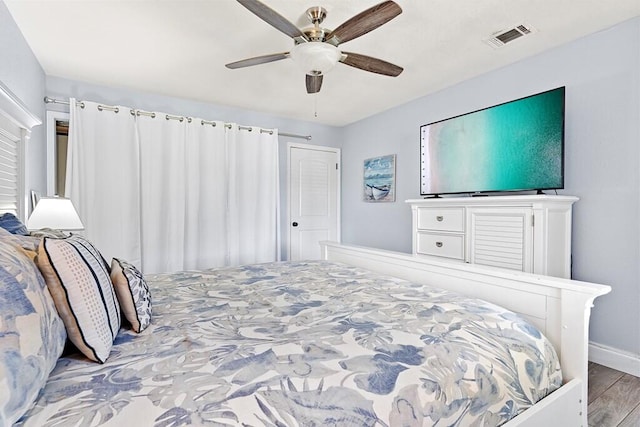 bedroom featuring ceiling fan and light wood-type flooring