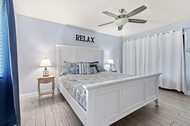 bedroom with hardwood / wood-style flooring and ceiling fan