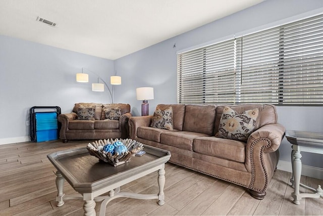 living room with light hardwood / wood-style floors