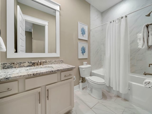 bathroom featuring toilet, marble finish floor, shower / bath combo with shower curtain, and vanity