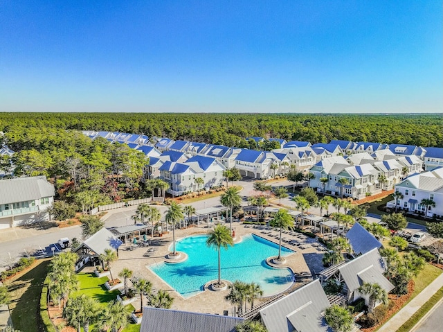 aerial view with a wooded view and a residential view