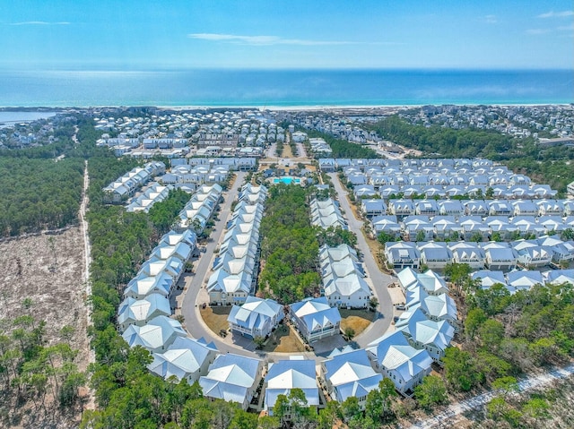 drone / aerial view featuring a water view and a residential view