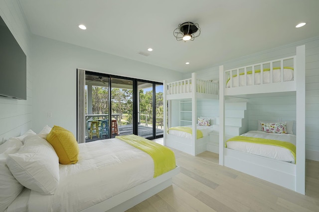 bedroom featuring light hardwood / wood-style floors and access to outside