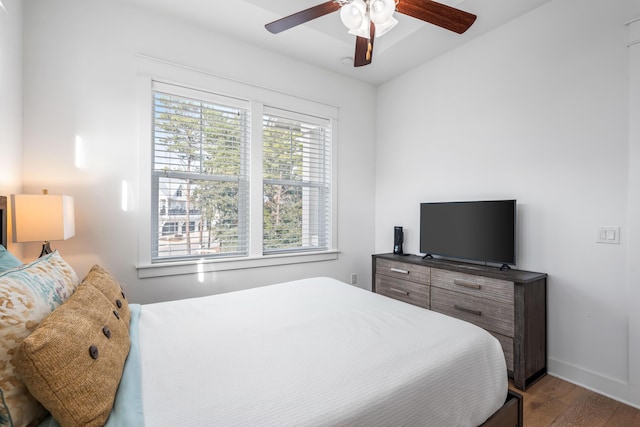 bedroom with ceiling fan and wood-type flooring