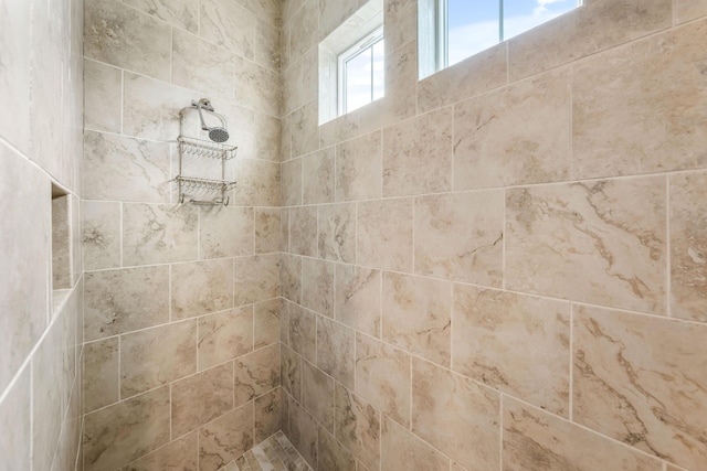 bathroom featuring tiled shower