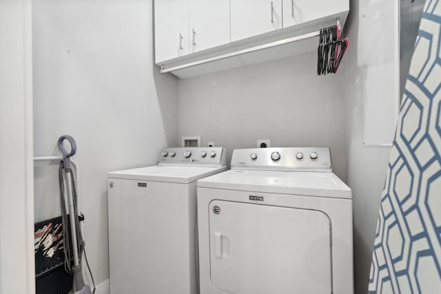 laundry area featuring cabinets and washer and dryer