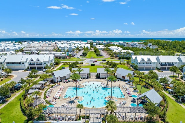 birds eye view of property with a water view