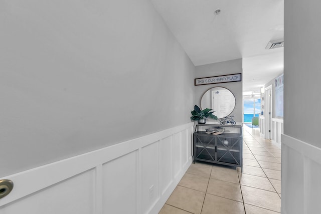 hallway with light tile patterned floors