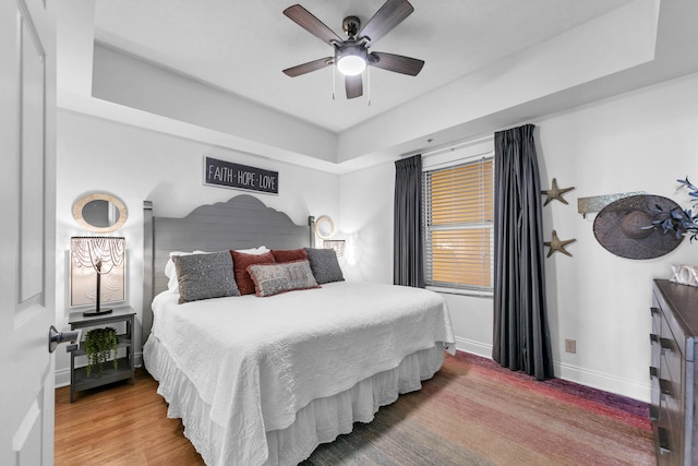 bedroom featuring hardwood / wood-style floors and ceiling fan