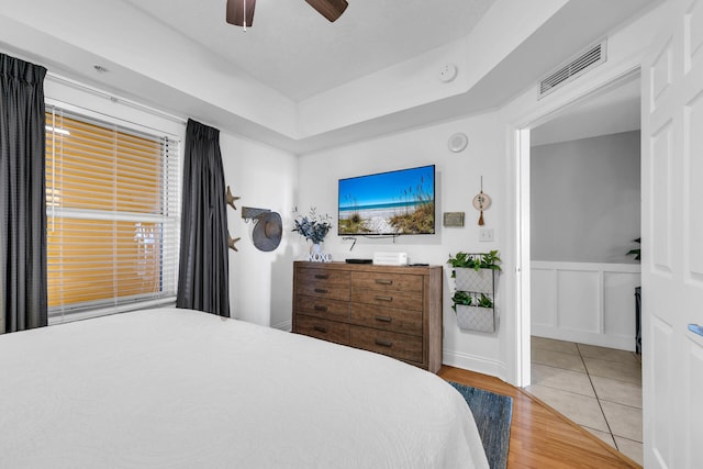 bedroom with ceiling fan and light hardwood / wood-style flooring