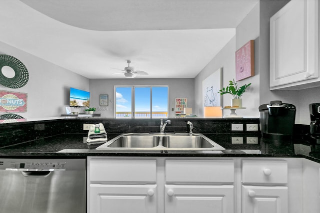 kitchen with white cabinetry, dishwasher, sink, dark stone counters, and ceiling fan