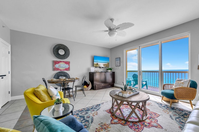 living room with light tile patterned floors and ceiling fan