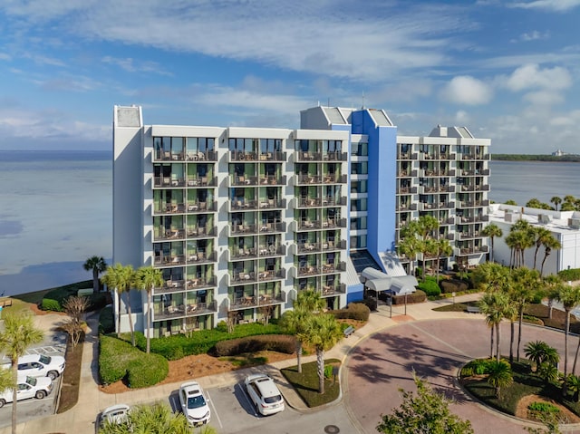 view of building exterior with a water view