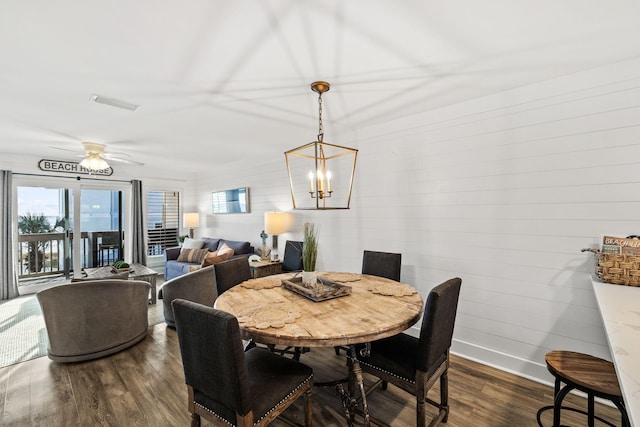 dining area with dark hardwood / wood-style floors and ceiling fan