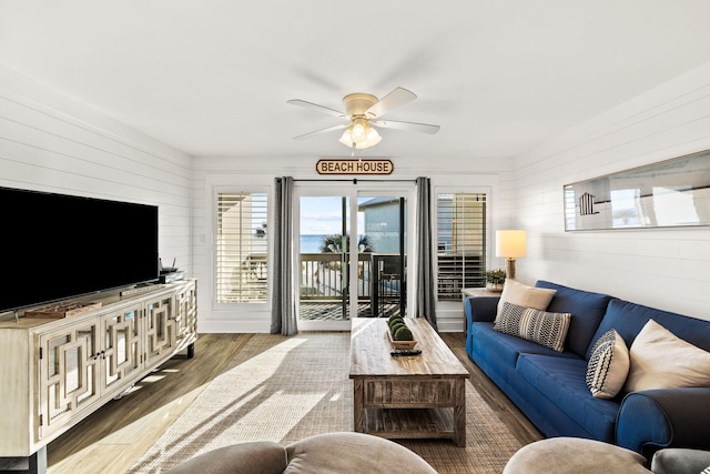 living room with hardwood / wood-style floors and ceiling fan