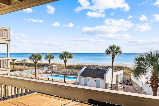 exterior space with a water view and a view of the beach