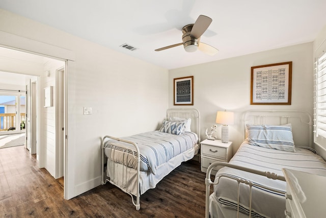 bedroom featuring ceiling fan and dark hardwood / wood-style flooring