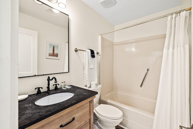 full bathroom featuring vanity, shower / tub combo, and toilet