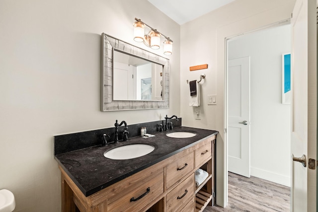 bathroom with hardwood / wood-style flooring and vanity