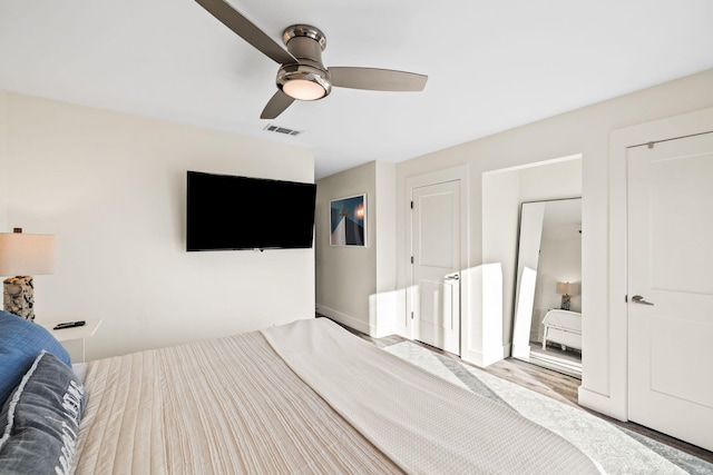 bedroom featuring ceiling fan and light hardwood / wood-style flooring