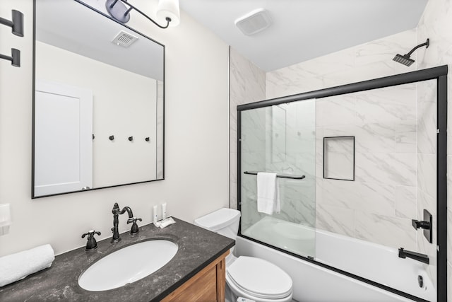 23011 Front Beach Rd Unit 65, Panama City Beach, FL 32413 - bathroom with vanity, toilet, and shower / bath combination with glass door
