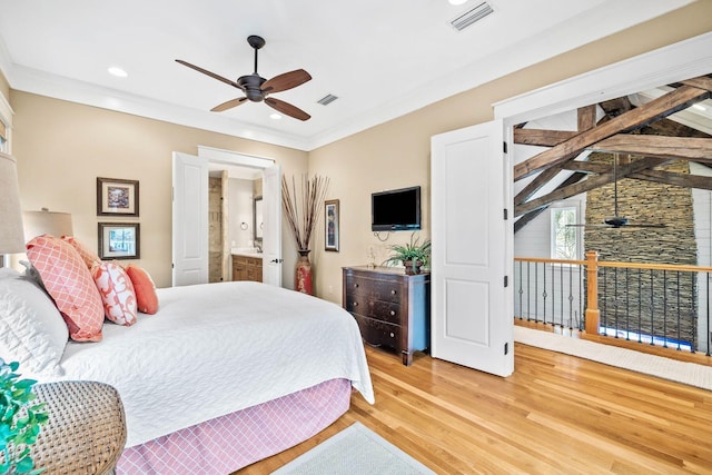 bedroom featuring crown molding, visible vents, and light wood-style floors