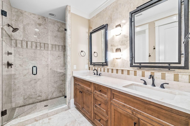 bathroom featuring double vanity, ornamental molding, a sink, and a shower stall