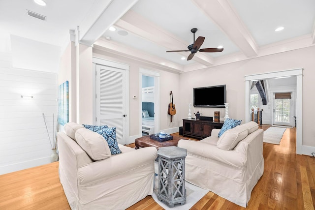 living area with recessed lighting, wood finished floors, visible vents, baseboards, and beam ceiling