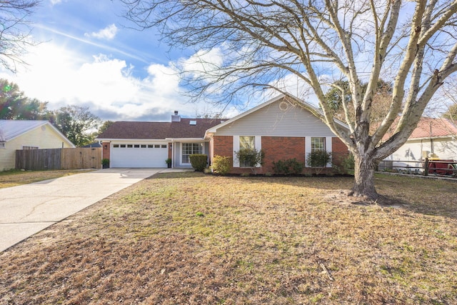 ranch-style home featuring a garage and a front yard