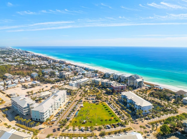 drone / aerial view featuring a water view and a beach view