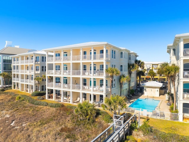 view of property featuring a community pool